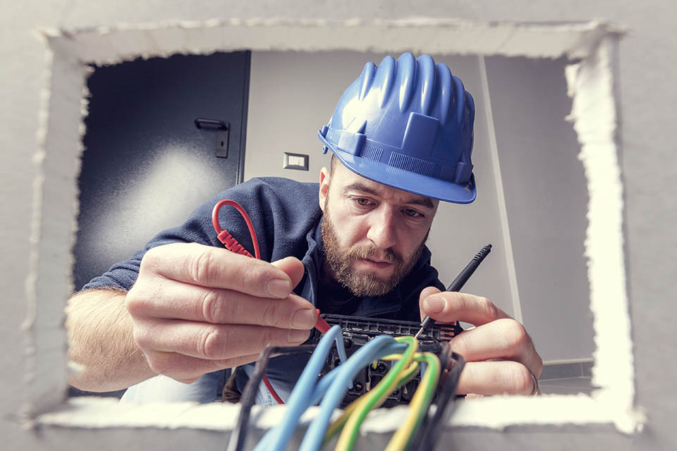 Electrician connecting electrical wires