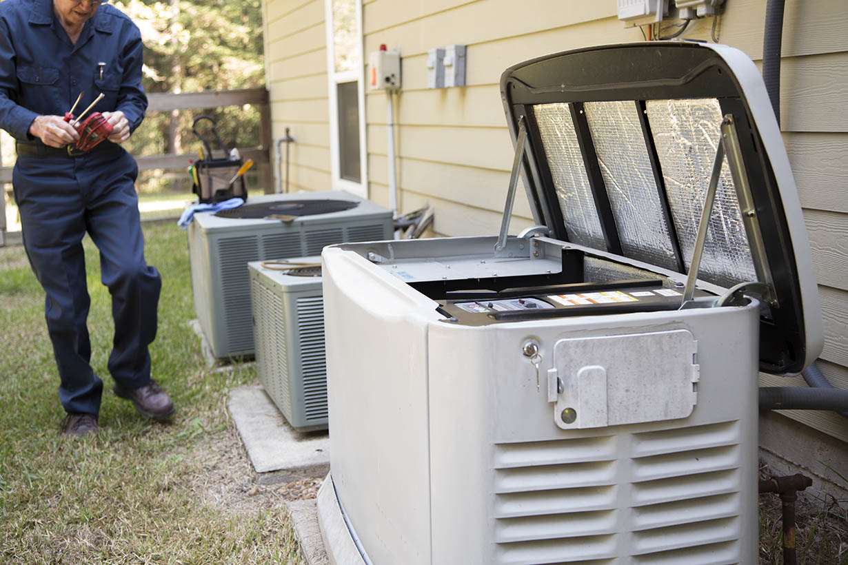 Technician services outside AC units and generator